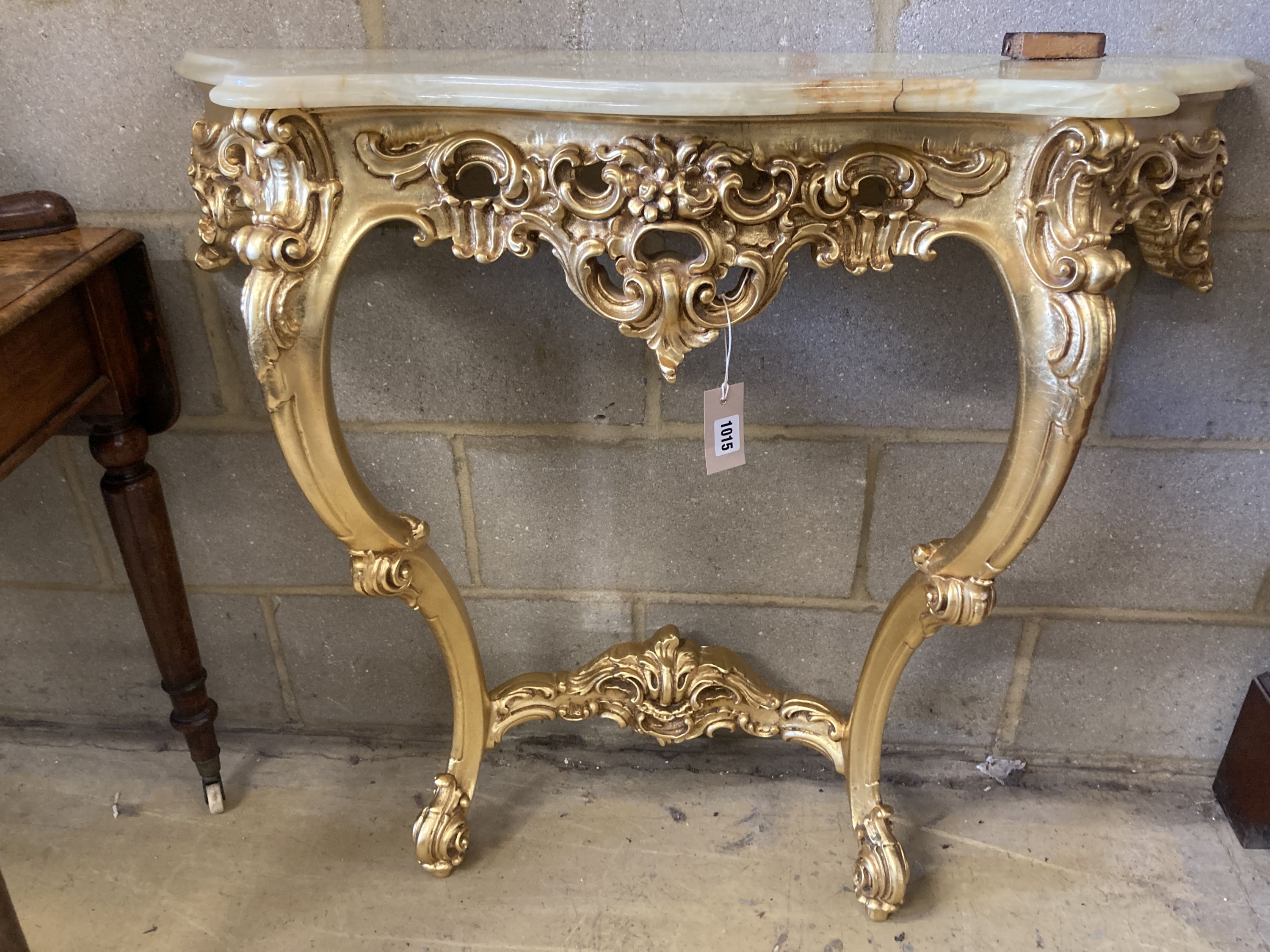 An 18th century style onyx topped gilt console table, width 94cm, depth 29cm, height 87cm with mirror